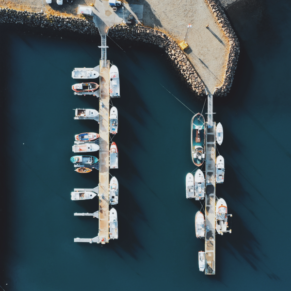 Events Guys An aerial view of boats docked at a marina during an event.