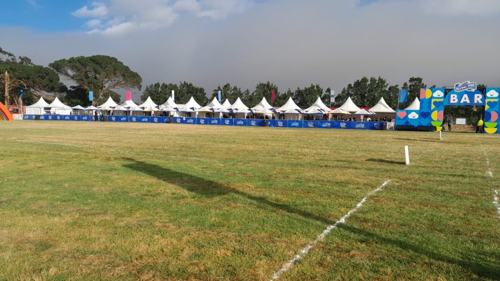 Discover Your Perfect Tent to Hire in South Africa Today! 2 Events Guys A grassy field with tents available for hire in the background.