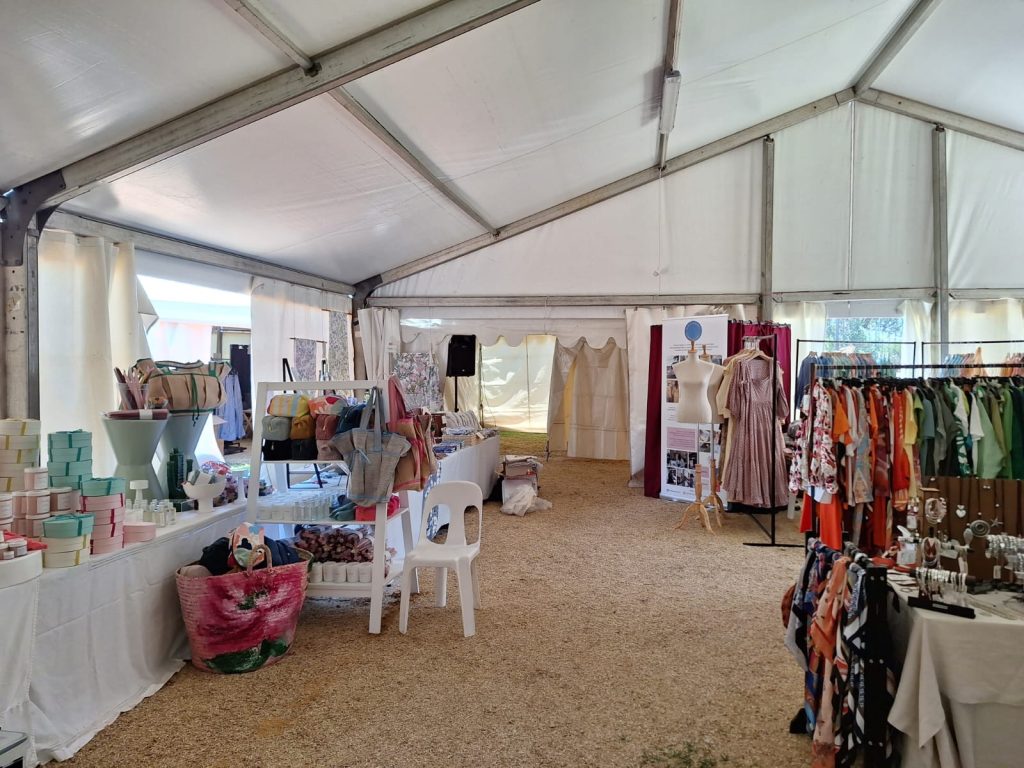 Explore Premium Tent Hire Options Across South Africa 2 Events Guys A tent filled with clothes and other items available for hire.